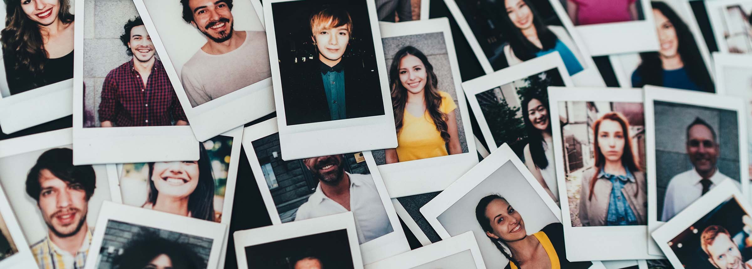 a pile of polaroid photos of college students